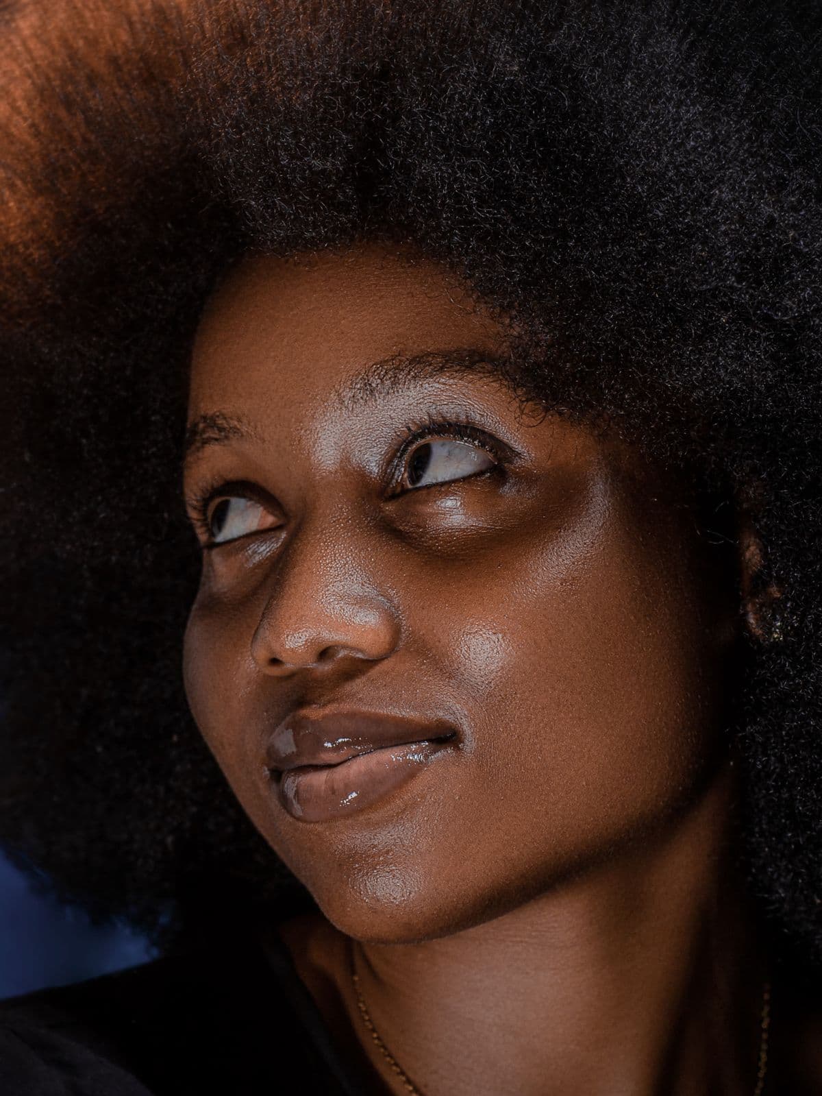 A confident woman with radiant, natural skin